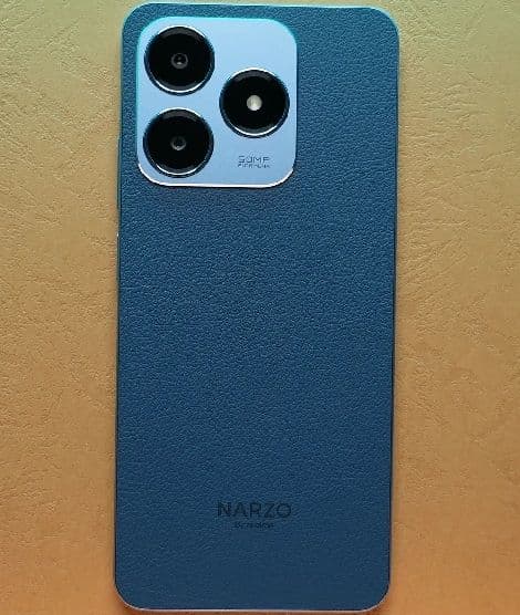 https://s3.ap-south-1.amazonaws.com/comparos/uploads/Realme_Narzo_N63_Rear_View_e01fec2824.jpg